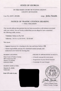 Scam alert example showing a fraudulent mobile phone text message demanding immediate traffic citation payment via an unverified link.