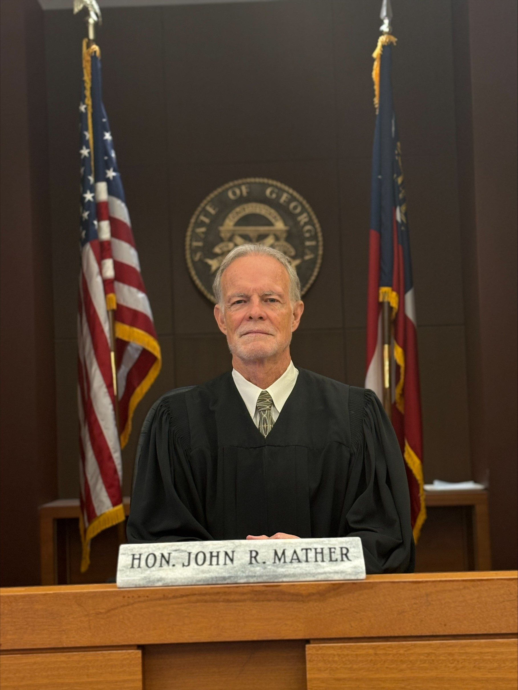 Official portrait of Judge John R. Mather in judicial robes.